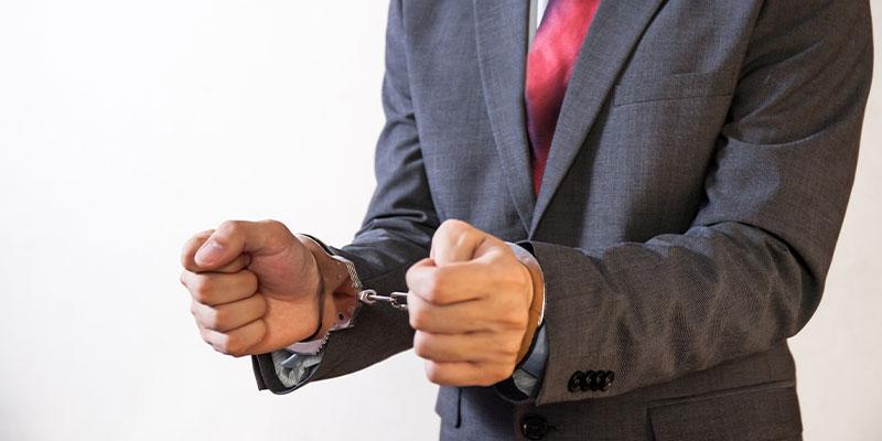 Misdemeanor Lawyer in cuffs